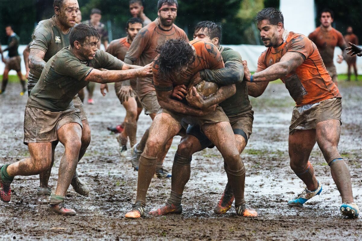 a group of men playing a game of rugby